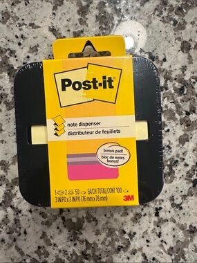 Post-it  note dispenser with a bonus sticky notepad.